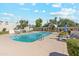 Community swimming pool surrounded by lounge chairs and lush landscaping at 4336 E Piccadilly Rd, Phoenix, AZ 85018