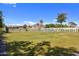 Spacious backyard with well-maintained lawn, a pool, and privacy landscaping, creating a serene outdoor oasis at 4456 E Earll Dr, Phoenix, AZ 85018