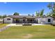 Stunning backyard view showcasing the home's exterior, outdoor living space, and beautifully manicured lawn at 4456 E Earll Dr, Phoenix, AZ 85018