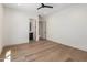 Bright bedroom featuring hardwood flooring, a ceiling fan, and an ensuite bathroom at 4456 E Earll Dr, Phoenix, AZ 85018