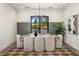 Stylish dining room with modern decor, a large table, and elegant lighting provides a comfortable ambiance at 4456 E Earll Dr, Phoenix, AZ 85018