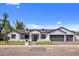 Charming updated one-story home featuring a modern design, professional landscaping, and a three-car garage at 4456 E Earll Dr, Phoenix, AZ 85018