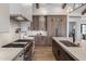 Well-equipped kitchen with stone countertops and a large island offers ample space for cooking and entertaining at 4456 E Earll Dr, Phoenix, AZ 85018
