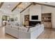 Cozy living room with a fireplace, built-in shelving, and comfortable seating for relaxing or entertaining at 4456 E Earll Dr, Phoenix, AZ 85018