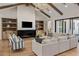 Bright open living room with fireplace and built in shelving offers a seamless transition to the patio at 4456 E Earll Dr, Phoenix, AZ 85018