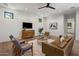 Stylish living room with hardwood floors, media cabinet, and modern art at 4456 E Earll Dr, Phoenix, AZ 85018