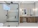 Luxurious main bathroom with glass shower and double vanity at 4456 E Earll Dr, Phoenix, AZ 85018