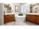 Bathroom featuring double vanities and a soaking tub at 4626 E Blue Spruce Ln, Gilbert, AZ 85298