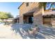 Community center with stone facade, landscaped entrance, and covered walkway offers inviting neighborhood gathering space at 4626 E Blue Spruce Ln, Gilbert, AZ 85298