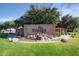 Beautiful community entrance sign surrounded by lush landscaping and calming water features at 4626 E Blue Spruce Ln, Gilbert, AZ 85298