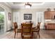 Bright dining area featuring wood floors, a round table, and stylish furnishings at 4626 E Blue Spruce Ln, Gilbert, AZ 85298