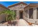 Close-up of the front door, accented by desert landscaping and a stone facade at 4626 E Blue Spruce Ln, Gilbert, AZ 85298