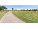 Manicured golf course pathway with lush green grass and beautiful scenery in the distance at 4626 E Blue Spruce Ln, Gilbert, AZ 85298