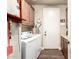 Laundry room with washer, dryer, and utility sink, and cabinets at 4626 E Blue Spruce Ln, Gilbert, AZ 85298