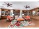 Cozy library featuring built-in bookcases, comfortable seating, and natural light at 4626 E Blue Spruce Ln, Gilbert, AZ 85298
