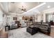 Inviting living room featuring hardwood floors, plush seating, and an open layout at 4626 E Blue Spruce Ln, Gilbert, AZ 85298