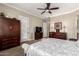 Spacious main bedroom with ample storage, a ceiling fan, and exterior access at 4626 E Blue Spruce Ln, Gilbert, AZ 85298