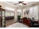 Well-lit home office with views into the living room and kitchen at 4626 E Blue Spruce Ln, Gilbert, AZ 85298