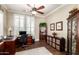 Home office with natural light, built-in shelving, and ample workspace at 4626 E Blue Spruce Ln, Gilbert, AZ 85298
