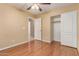 This bedroom has hardwood floors, closet with slider doors, and ceiling fan at 4826 W Ardmore Rd, Laveen, AZ 85339