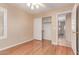 A cozy bedroom features laminate floors, a ceiling fan and a double-door closet for easy storage at 4826 W Ardmore Rd, Laveen, AZ 85339