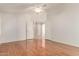 Bedroom with hardwood floors and an open view to other rooms at 4826 W Ardmore Rd, Laveen, AZ 85339