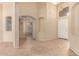 Spacious entryway featuring archways, neutral paint, tile flooring, and a view to the living room at 4826 W Ardmore Rd, Laveen, AZ 85339