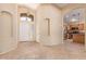 Welcoming foyer with neutral walls, tile flooring, archways, and views of the kitchen area at 4826 W Ardmore Rd, Laveen, AZ 85339