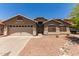 Charming single-story home with a two-car garage, well-kept landscape, and neutral colored stucco at 4826 W Ardmore Rd, Laveen, AZ 85339