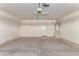 A spacious garage with water heater, door to backyard, and plenty of extra room at 4826 W Ardmore Rd, Laveen, AZ 85339
