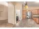 Spacious kitchen featuring stainless steel appliances and a convenient laundry room access at 4826 W Ardmore Rd, Laveen, AZ 85339