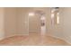 Open living space with an archway view to the kitchen at 4826 W Ardmore Rd, Laveen, AZ 85339