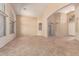 Spacious living room with neutral paint, tile flooring, arched doorways, and plenty of natural light at 4826 W Ardmore Rd, Laveen, AZ 85339