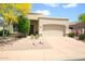 Charming home featuring a two-car garage, desert landscaping, and inviting entryway with security door at 5014 E Kirkland Rd, Phoenix, AZ 85054