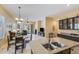 An open kitchen view showcasing the central island and seamlessly connects to the living room and outdoor spaces at 5014 E Kirkland Rd, Phoenix, AZ 85054
