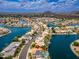 Wide aerial shot showcasing waterfront homes, serene canals, and stunning mountain views in a luxurious neighborhood at 5510 W Arrowhead Lakes Dr, Glendale, AZ 85308