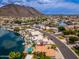 Wide aerial shot showcasing home with lake access, pool, and gorgeous mountain views in a desirable neighborhood at 5510 W Arrowhead Lakes Dr, Glendale, AZ 85308
