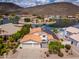 Aerial view of a beautiful home with a three-car garage, tile roof, pool, and lake access at 5510 W Arrowhead Lakes Dr, Glendale, AZ 85308