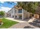 Exterior of home showcasing the back patio, backyard, pool, and lake views beyond at 5510 W Arrowhead Lakes Dr, Glendale, AZ 85308