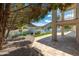Covered patio leading to a backyard oasis with a pool, lake view, and mountain views at 5510 W Arrowhead Lakes Dr, Glendale, AZ 85308