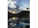 Backyard pool overlooking the lake and mountains of a waterfront property at 5510 W Arrowhead Lakes Dr, Glendale, AZ 85308