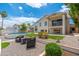 Inviting backyard with a refreshing pool, cozy fire pit area, and mature landscaping at 5510 W Arrowhead Lakes Dr, Glendale, AZ 85308