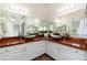 Double vanity bathroom with sleek, modern vessel sinks and bright lighting at 5510 W Arrowhead Lakes Dr, Glendale, AZ 85308