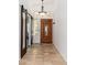 Welcoming entryway with tile flooring, sliding barn doors, decorative lighting, and an elegant wooden door at 5510 W Arrowhead Lakes Dr, Glendale, AZ 85308