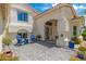 Inviting front porch with stylish chairs, vibrant potted plants, and a decorative door leading to the home at 5510 W Arrowhead Lakes Dr, Glendale, AZ 85308