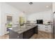 Modern kitchen featuring an island with granite countertops and white cabinets at 5510 W Arrowhead Lakes Dr, Glendale, AZ 85308