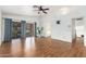 Spacious room with water views, ceiling fan, and hardwood flooring at 5510 W Arrowhead Lakes Dr, Glendale, AZ 85308