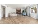 Cozy living room with a brick fireplace and light wood flooring at 5510 W Arrowhead Lakes Dr, Glendale, AZ 85308