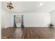 Bright and spacious living room with wood floors, ample natural light, and minimalist decor at 5510 W Arrowhead Lakes Dr, Glendale, AZ 85308