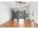 Bright living area with water views, hardwood floors, and ceiling fan at 5510 W Arrowhead Lakes Dr, Glendale, AZ 85308
